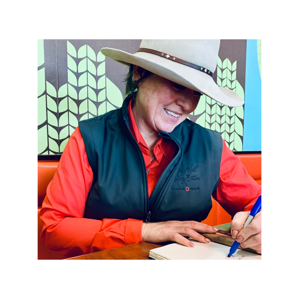 Author and horsewoman Lee McLean signing a book